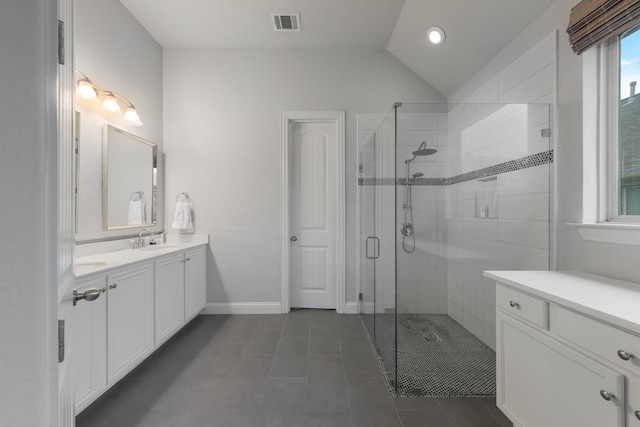 5604 Ridgeson Dr, Mckinney, TX 75071 - bathroom featuring a shower stall, tile patterned floors, vanity, lofted ceiling, and baseboards