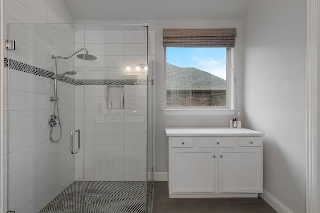 5604 Ridgeson Dr, Mckinney, TX 75071 - bathroom featuring baseboards, a shower stall, and tile patterned floors