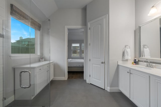 5604 Ridgeson Dr, Mckinney, TX 75071 - ensuite bathroom featuring healthy amount of natural light, baseboards, a shower stall, and vaulted ceiling