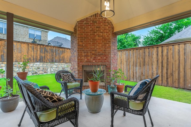 5604 Ridgeson Dr, Mckinney, TX 75071 - view of patio with an outdoor brick fireplace and a fenced backyard