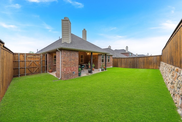 5604 Ridgeson Dr, Mckinney, TX 75071 - rear view of house featuring brick siding, a patio area, a chimney, roof with shingles, and a gate