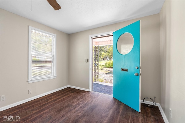 entryway with wood finished floors, baseboards, and ceiling fan