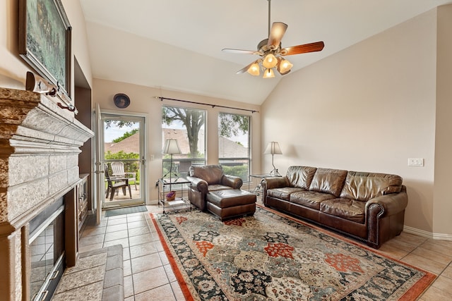 1453 Cattle Baron Ct, Fairview, TX 75069 - living room featuring a fireplace, a ceiling fan, vaulted ceiling, light tile patterned floors, and baseboards