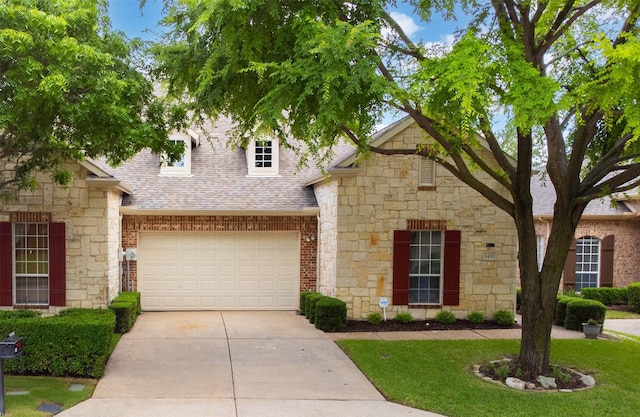 1453 Cattle Baron Ct, Fairview, TX 75069 - view of front of home featuring roof with shingles, concrete driveway, stone siding, and a front lawn