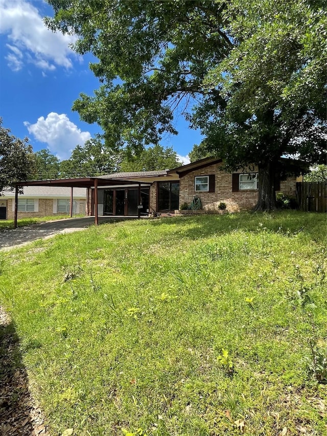 905 Seymore Cir, Denison, TX 75020 - view of front of property featuring an attached carport, a front lawn, and driveway