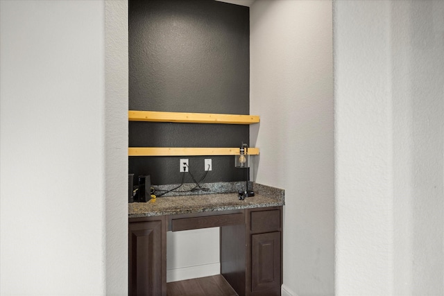 bar area with dark wood-style flooring
