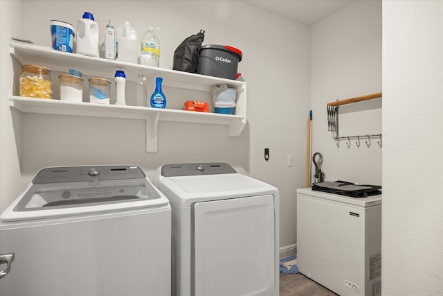 laundry area with washing machine and clothes dryer