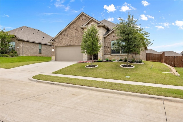 traditional-style house featuring driveway, brick siding, an attached garage, and stone siding