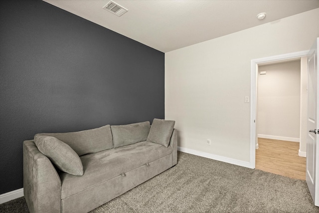 living room featuring baseboards and carpet floors