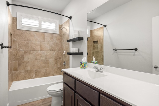 full bathroom with toilet, washtub / shower combination, vanity, and wood finished floors