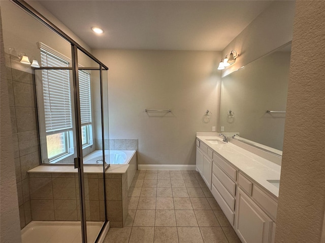 full bath featuring tile patterned floors, a garden tub, double vanity, baseboards, and an enclosed shower