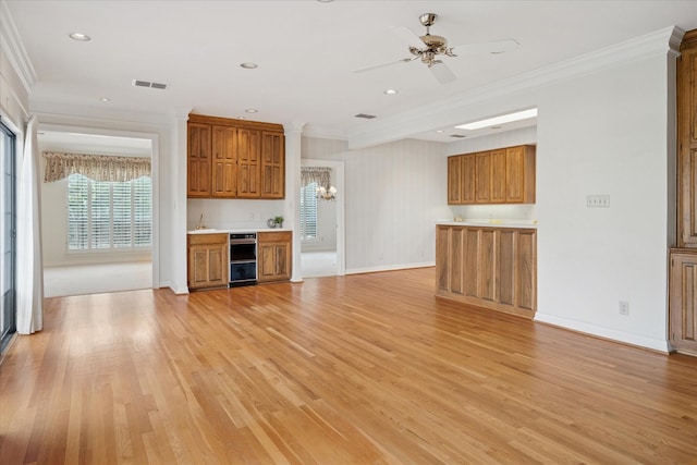1817 Crockett Cir, Irving, TX 75038 - unfurnished living room with ornamental molding, light wood-style flooring, a ceiling fan, recessed lighting, and baseboards