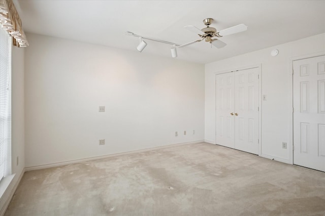 1817 Crockett Cir, Irving, TX 75038 - empty room with carpet flooring, a ceiling fan, and baseboards