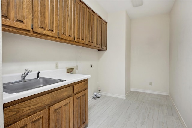 1817 Crockett Cir, Irving, TX 75038 - laundry room with hookup for an electric dryer, cabinet space, hookup for a washing machine, and baseboards