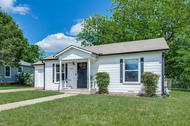 2420 N Carroll Blvd, Denton, TX 76201 - view of front of house with a front lawn, an attached garage, crawl space, and a shingled roof