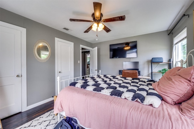 2420 N Carroll Blvd, Denton, TX 76201 - bedroom with wood finished floors, baseboards, and a ceiling fan