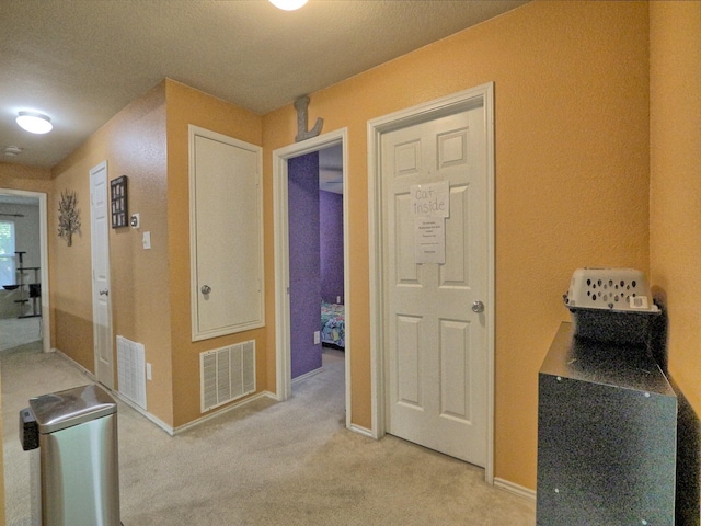 8614 Mountain Blf, Dallas, TX 75227 - hall featuring light colored carpet and baseboards