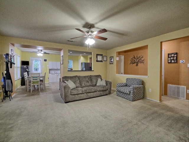 8614 Mountain Blf, Dallas, TX 75227 - living area featuring a ceiling fan, carpet flooring, a textured ceiling, and baseboards