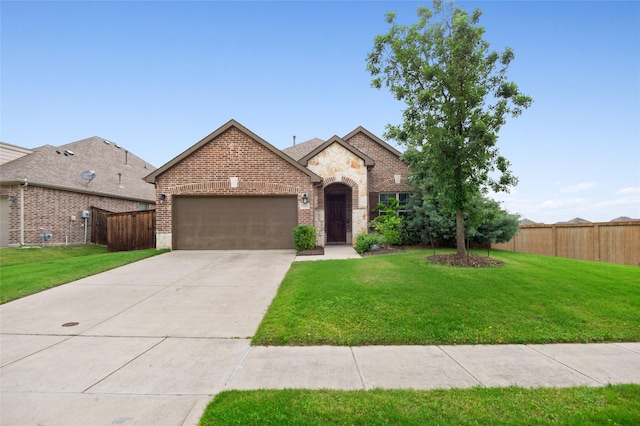 7500 W Fork Ln, Mckinney, TX 75071 - french country home featuring an attached garage, brick siding, driveway, and stone siding