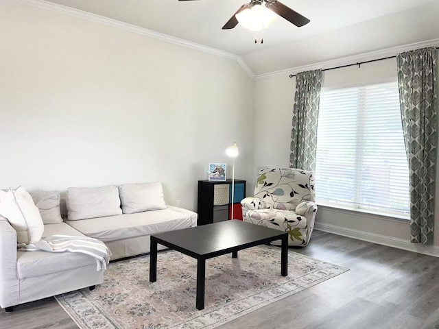 7500 W Fork Ln, Mckinney, TX 75071 - living room featuring crown molding, baseboards, a ceiling fan, healthy amount of natural light, and wood finished floors