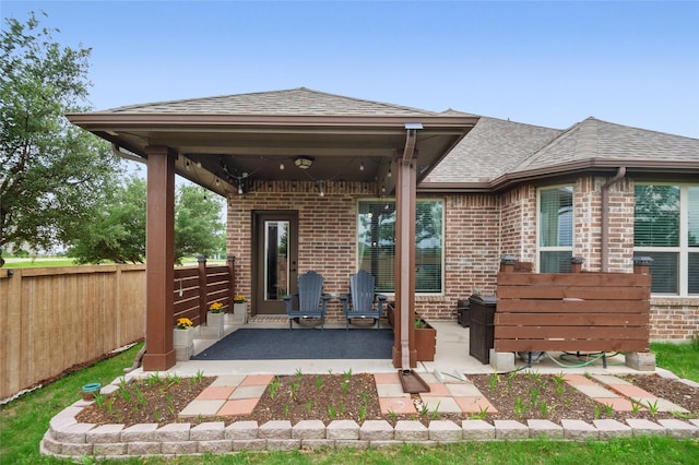 7500 W Fork Ln, Mckinney, TX 75071 - view of front facade featuring brick siding, fence, roof with shingles, and a patio