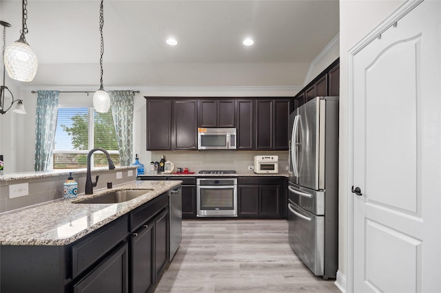 7500 W Fork Ln, Mckinney, TX 75071 - kitchen with stainless steel appliances, a sink, decorative backsplash, recessed lighting, and light stone counters