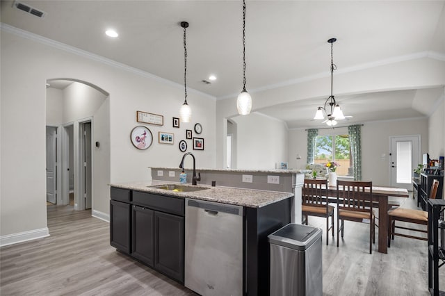 7500 W Fork Ln, Mckinney, TX 75071 - kitchen with stainless steel dishwasher, a sink, arched walkways, an island with sink, and light wood-style floors