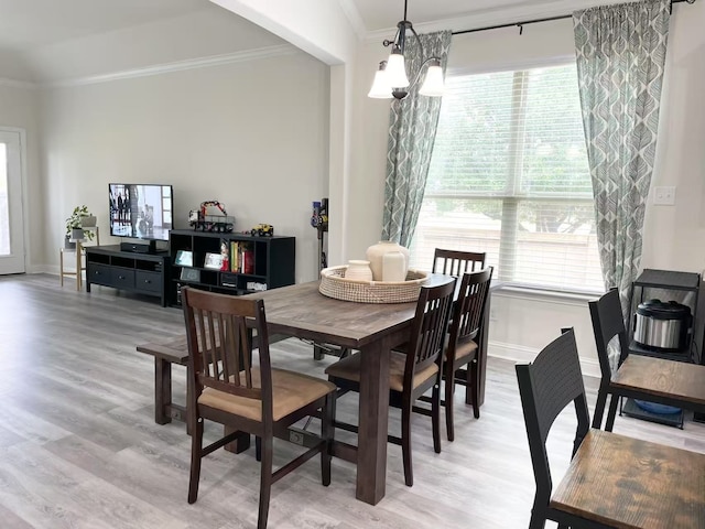 7500 W Fork Ln, Mckinney, TX 75071 - dining space featuring ornamental molding, plenty of natural light, light wood-type flooring, and baseboards