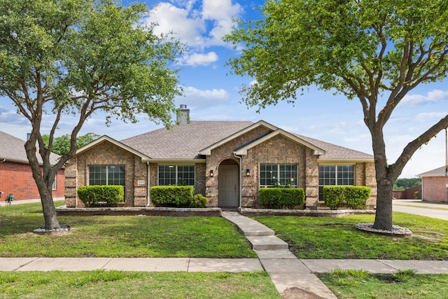 549 Seminole Trl, Murphy, TX 75094 - single story home featuring a front lawn, a chimney, brick siding, and roof with shingles