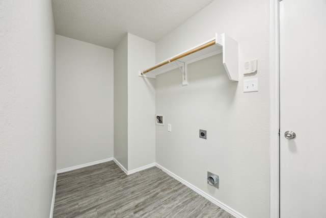549 Seminole Trl, Murphy, TX 75094 - clothes washing area with hookup for an electric dryer, hookup for a washing machine, wood finished floors, and baseboards