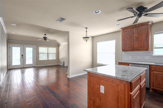 1443 Teal, Sherman, TX 75092 - kitchen featuring a ceiling fan, stainless steel dishwasher, baseboards, open floor plan, and a kitchen island