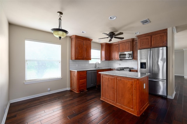 1443 Teal, Sherman, TX 75092 - kitchen with stainless steel appliances, baseboards, decorative backsplash, a ceiling fan, and dark wood-style floors