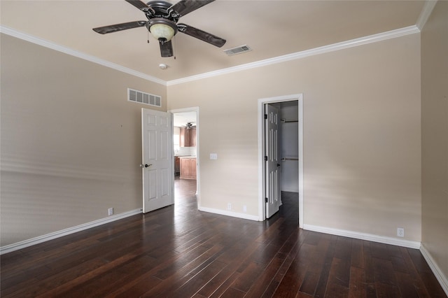 1443 Teal, Sherman, TX 75092 - unfurnished bedroom featuring dark wood-style flooring, crown molding, baseboards, a spacious closet, and a ceiling fan