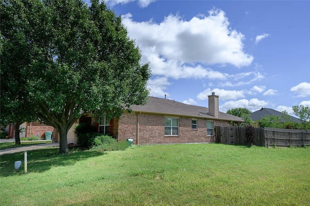 1443 Teal, Sherman, TX 75092 - back of house with brick siding and a chimney