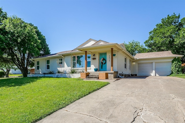 view of front facade featuring an attached garage, concrete driveway, a front lawn, and brick siding
