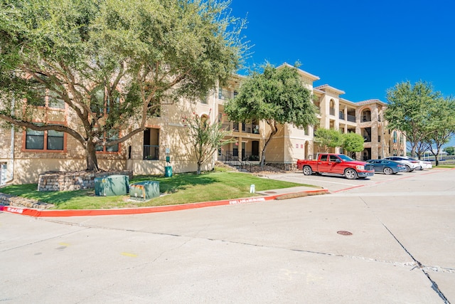 2131 Portofino Dr, Rockwall, TX 75032 - view of building exterior featuring uncovered parking