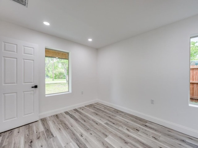 224 High St, Roxton, TX 75477 - unfurnished room with light wood finished floors, baseboards, and recessed lighting