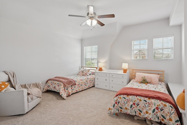 bedroom featuring light colored carpet, a ceiling fan, and lofted ceiling
