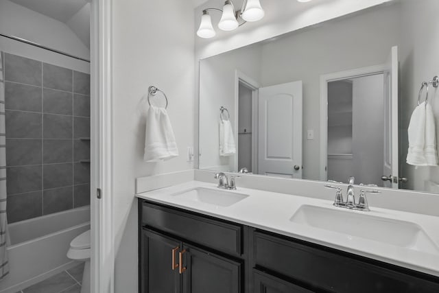 full bath with toilet, double vanity, shower / bathtub combination, and tile patterned floors