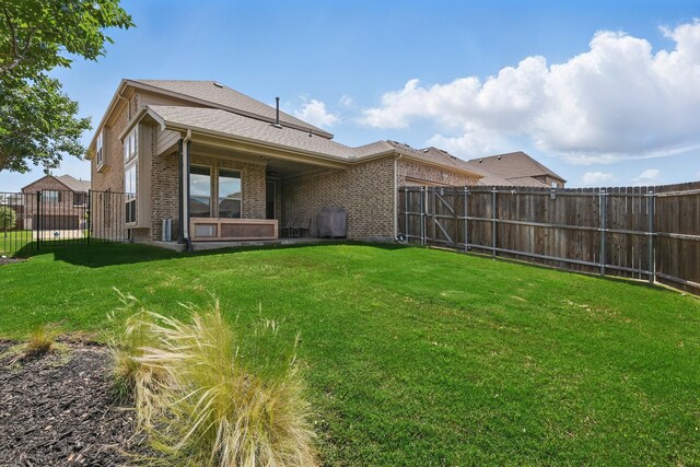 back of property featuring brick siding