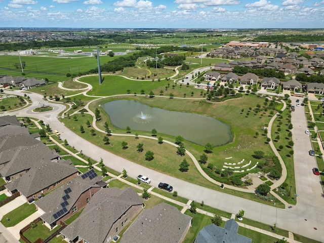 aerial overview of property's location with a nearby body of water and nearby suburban area