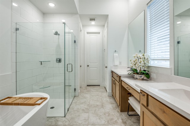 1905 Halkin Rd, Celina, TX 75009 - full bath featuring vanity, a shower stall, a freestanding bath, and tile patterned flooring