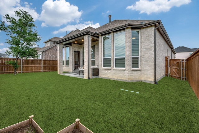 1905 Halkin Rd, Celina, TX 75009 - rear view of property featuring brick siding and a patio