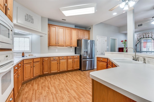 1811 Ashford Ln, Midlothian, TX 76065 - kitchen with white appliances, a sink, ceiling fan, light wood-type flooring, and light countertops