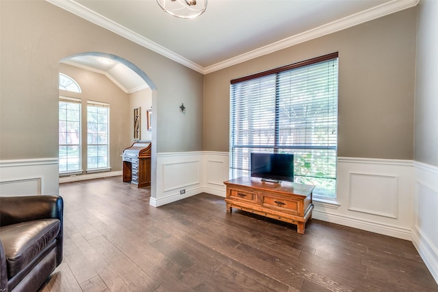 3625 Cottonwood Springs Dr, The Colony, TX 75056 - sitting room with arched walkways, wainscoting, ornamental molding, dark wood-style floors, and a decorative wall