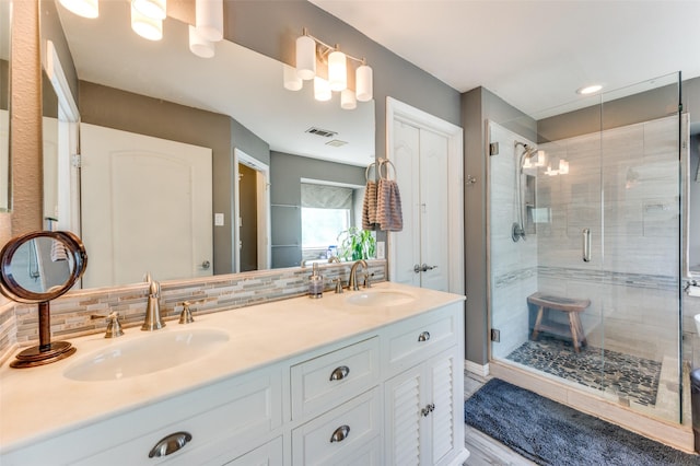 3625 Cottonwood Springs Dr, The Colony, TX 75056 - full bathroom with a shower stall, double vanity, and tasteful backsplash