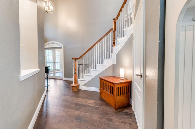 3625 Cottonwood Springs Dr, The Colony, TX 75056 - entrance foyer with wood finished floors, baseboards, arched walkways, french doors, and a textured wall