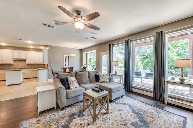 3625 Cottonwood Springs Dr, The Colony, TX 75056 - living area with ceiling fan and light wood-style floors