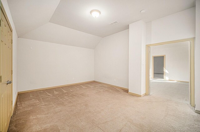 1432 Fence Post Dr, Fort Worth, TX 76052 - additional living space with light colored carpet, lofted ceiling, and baseboards