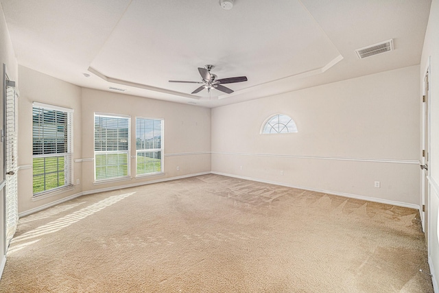 1432 Fence Post Dr, Fort Worth, TX 76052 - carpeted spare room featuring a raised ceiling, a ceiling fan, plenty of natural light, and baseboards